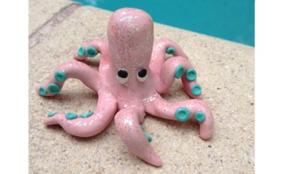 A pink and teal clay octopus.