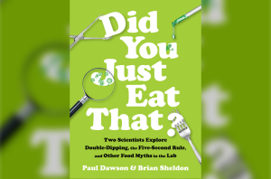 a green book cover with words 'did you just eat that?: : Two Scientists Explore Double-Dipping, the Five-Second Rule, and other Food Myths in the Lab' with images of a fork, a magnifying glass, a tweezer, and a pipette