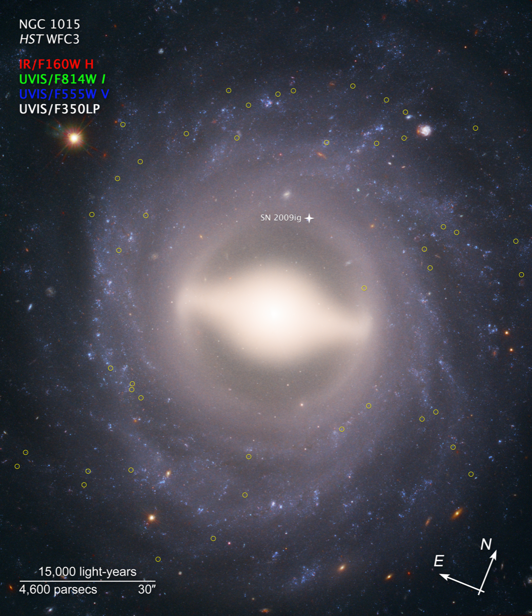 a circular, swirling galaxy with a bright center. there are yellow circles around particular stars in the photo