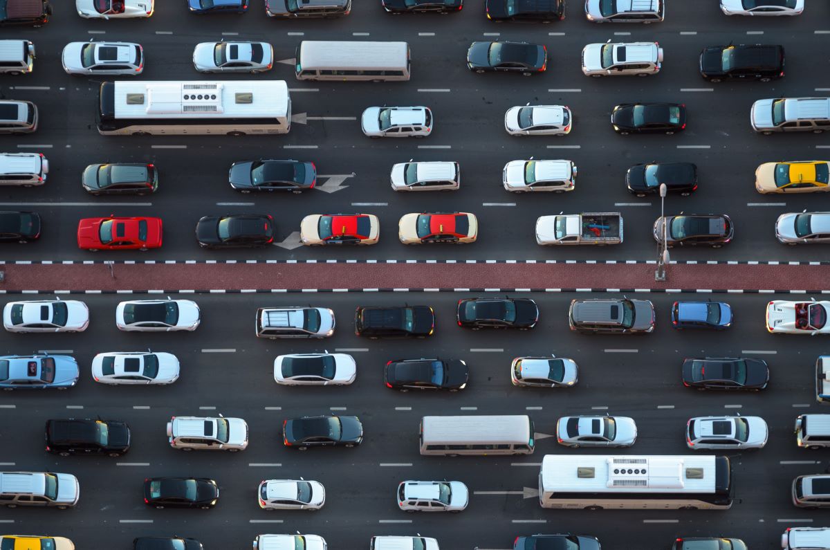 an aerial view of two lanes of traffic with bumper to bumper vehicles