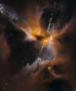 A jet of orange light passes through dark clouds in space.