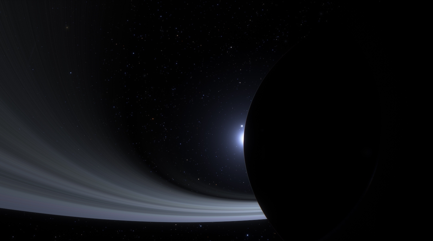 View of Saturn's rings, as seen from a distance, with the planet appearing in silhouette on the right edge of the frame. 3d render