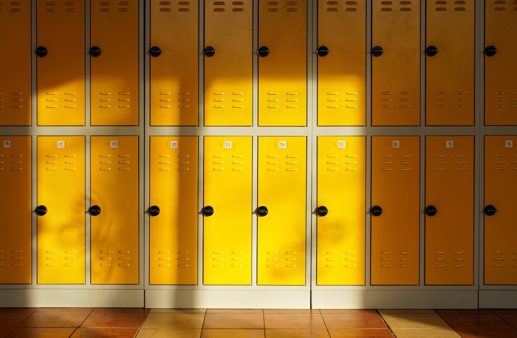 Sun shines in on a row of yellow lockers