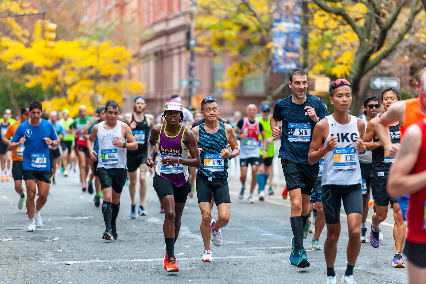 New York NY USA-November 6, 2022 Runners pass through Harlem in New York near the 22 mile mark near Mount Morris Park in the running of the TCS New York City Marathon