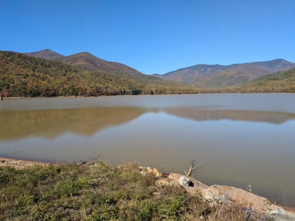 A body of water surrounded by mountainous terrain