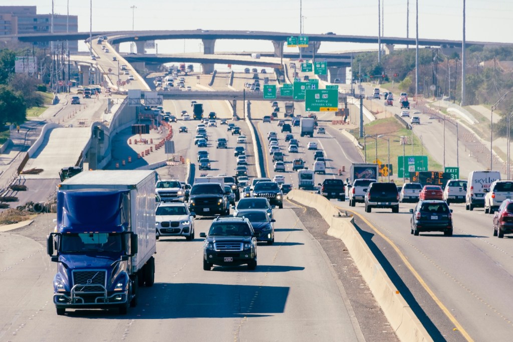 Cars driving along wide and complex highways in Texas