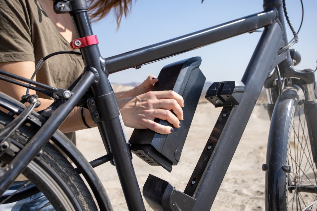 inserting e-bike battery on frame