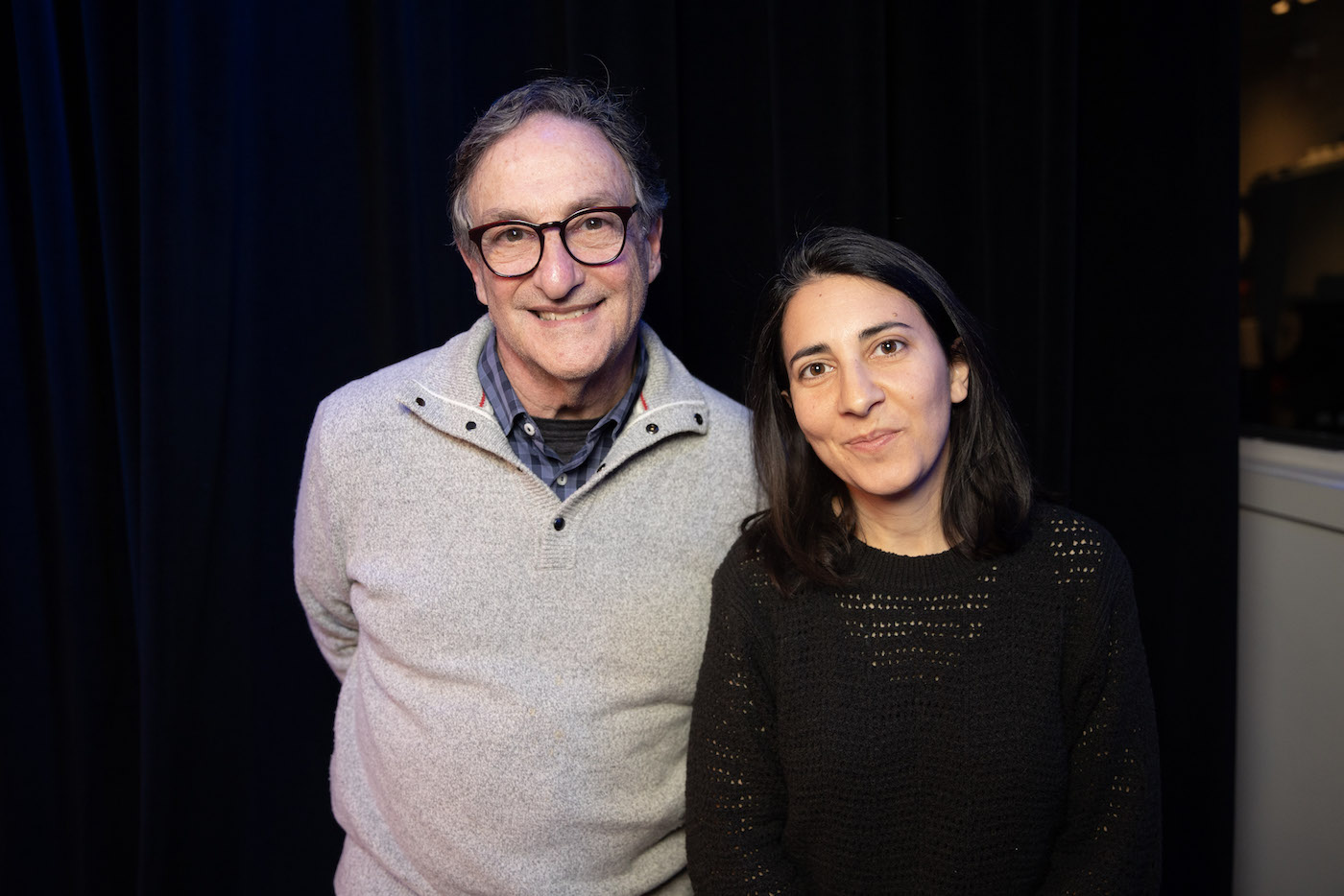 A man and a woman standing next to each other.